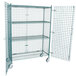 A Regency wire mesh security cage on wheels with two shelves.