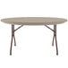 A Correll round folding table with mocha granite surface and legs on it.