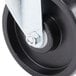 A close-up of a black Turbo Air swivel caster wheel with a metal pin.