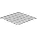 A grey metal grid shelf with lines.