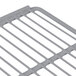 A Turbo Air gray coated wire shelf with metal handles.