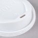 A Solo white plastic hot cup lid with a hole in it.