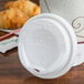 A Solo white plastic lid on a cup.