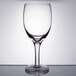 An Anchor Hocking Perfect Portions clear wine taster glass on a table.