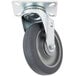A black swivel plate caster with a steel and rubber wheel.