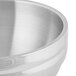 A Vollrath stainless steel double wall round beehive serving bowl.