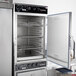 An Alto-Shaam stainless steel smoker oven with a door open.