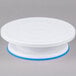 A white plastic Ateco cake turntable stand with blue trim.
