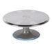 An Ateco revolving aluminum cake turntable with a blue non-slip base.