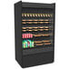 A black rectangular Structural Concepts Oasis air curtain display case with food and drinks inside.