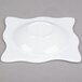 A white square melamine bowl with a small design on it.