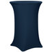 A navy blue Snap Drape Contour table cover on a round cocktail table.
