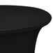 A black Snap Drape Contour table with a black spandex table cover on top.