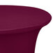 A burgundy Snap Drape Contour spandex table cover on a round bar table.