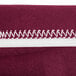 A burgundy Snap Drape spandex table cover with maroon and white stripes.