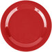 A white Carlisle melamine plate with a red rim.