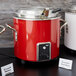 A red and white Vollrath retro stock pot kettle.