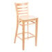A Lancaster Table & Seating wooden bar stool with a natural wood seat and ladder back.