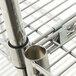 A Metro Super Erecta chrome wire shelving unit with metal pipes on the shelves.