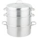 A stack of silver aluminum Vollrath Wear-Ever 3-tier vegetable steamers.