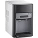 A black and white Follett 15 Series countertop ice maker and water dispenser.