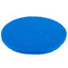 A blue Scrubble by ACS 53-17 cleaning floor pad.