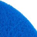 A close up of a blue Scrubble by ACS 53-17 floor pad.