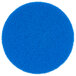 A blue circular Scrubble floor pad with small scrunched edges.