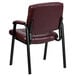 A burgundy Flash Furniture leather executive side chair with black legs.