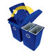 A blue Rubbermaid rectangular recycling station with a white lid and yellow recycle symbol.