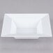 A white square Visions Florence plastic bowl.