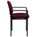 A burgundy Flash Furniture stackable side chair with black legs.