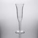 A Visions clear plastic champagne flute with a long stem.