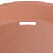 A close up of a terracotta plastic fast food basket.