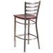 A Clear-Coated metal restaurant barstool with a mahogany wooden seat.