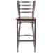 A Clear-Coated metal restaurant barstool with a mahogany wood seat.