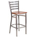 A Flash Furniture metal restaurant barstool with a clear-coated metal frame and a cherry wood seat.