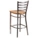 A Flash Furniture metal restaurant barstool with a natural wood seat and ladder back.