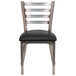 A Flash Furniture metal restaurant chair with a black vinyl seat.