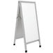 An Aarco aluminum A-Frame sign board with white marker board panels.