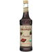 A 750 mL bottle of Monin Organic Chocolate Flavoring Syrup with a label.