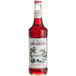 A Monin Blueberry Syrup 750 mL bottle filled with red liquid.