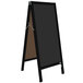 A black Aarco A-Frame chalkboard sign with a brown frame.