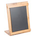 A black chalkboard on a wooden stand.