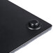 A black rectangular faux slate platter on a table.