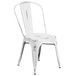 A Flash Furniture distressed white metal chair with a metal back.