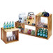 A Cal-Mil Madera rustic pine building block system shelf with drinks and glasses on it.