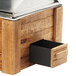 A wooden chafer with a lid and a metal drawer.