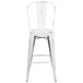 A Flash Furniture white metal bar stool with a vertical slat back.