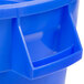 A close up of a blue Continental Huskee round bucket with a handle.
